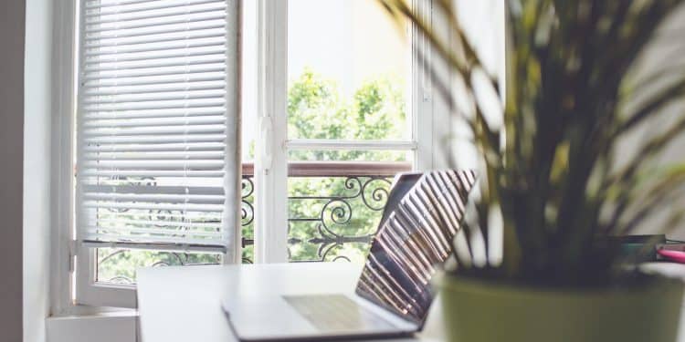 white and black striped chair near window